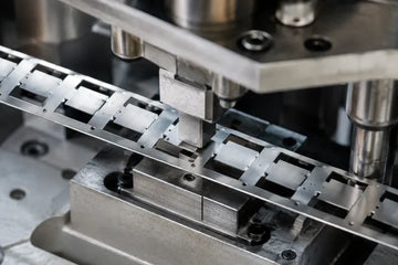 secondary shear caused by small punching clearance during precision metal stamping of EMI shielding components